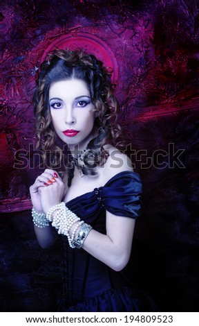 Victorian lady with bloody nimbus.Young woman in black dress and corset.