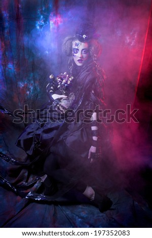 Halloween. Dark Doll. Young woman in holiday image of mystery gothic doll.