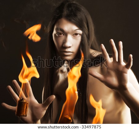 Portrait of asian man with fire