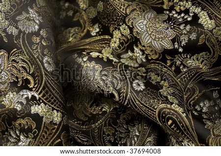 Silk black and gold fabric with asian pattern