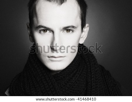 Portrait of young man in black scarf