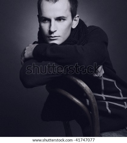 Black and white portrait of young man. Old foto style.