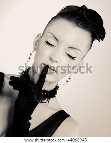 Vintage girl. Young lady in black gloves