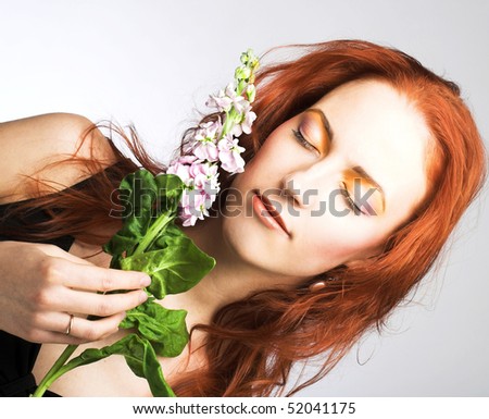 Portrait of young lady with white flower