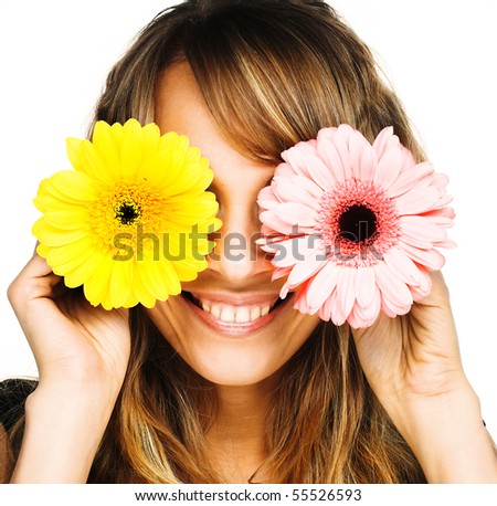 Young blond woman with flowers in her hands