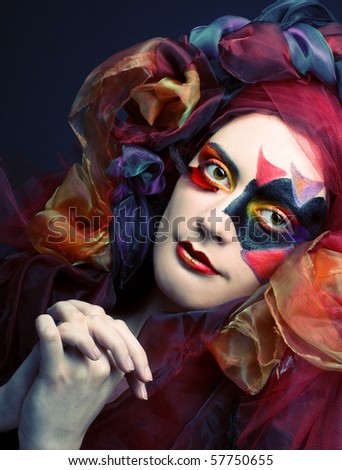how to do exotic makeup. stock photo : Young woman with creative make-up and in exotic hat