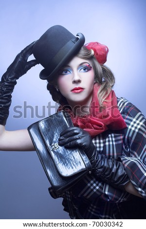 Young woman in vintage hat, checkered plaid and gloves.
