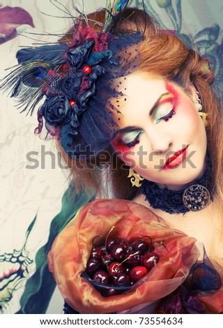 Portrait of young creative lady with cherries.