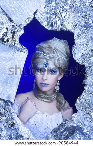 Ice-queen. Young lady in creative image.