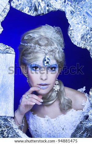 Ice-queen. Young lady in creative image.