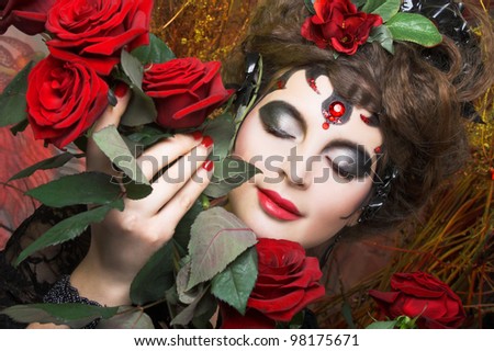 Spanish woman. Young woman in black with artistic visage and with rose in her hair