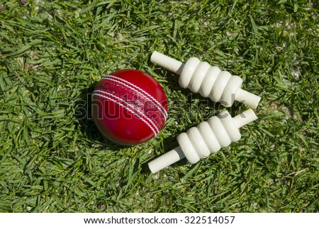 cricket ball and bails on oval