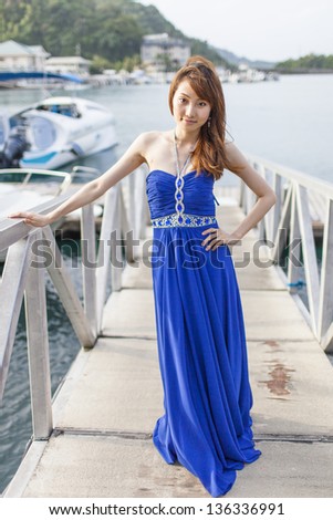 Pretty Chinese girl with blue full dress
