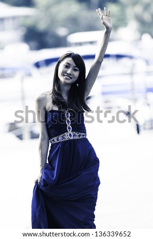 Pretty Chinese girl with blue full dress