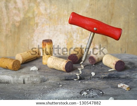 cork screw and wine corks in a wine cellar