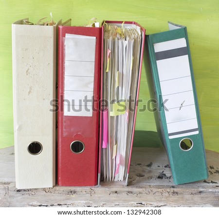 File folders, a bit messy, bureaucracy, red tape