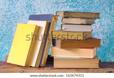 stack of old books, free copy space on yellow book cover