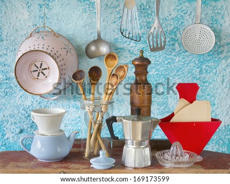 Various Vintage Kitchen Utensils,Against Blue Wall