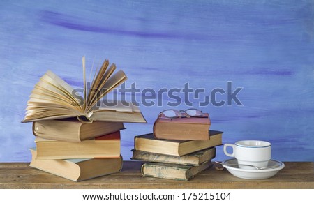 vintage books with coffee cup and spectacles, free copy space