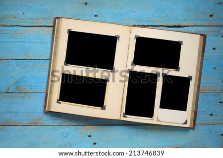 vintage book with empty photo frames, photo corners