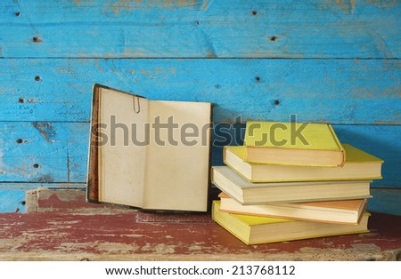 open book and a stack of books, free copy space