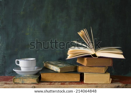 stack of books, open book, cup of coffee, chalk board, free copy space