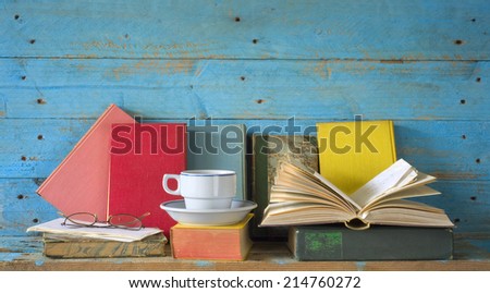 vintage books with coffee cup and spectacles, free copy space