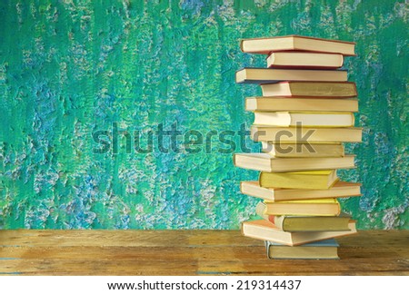 stack of books, grungy background, free copy space