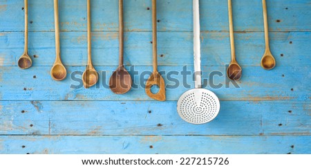 old wooden spoons, and an old skimmer, kitchen utensils cooking concept