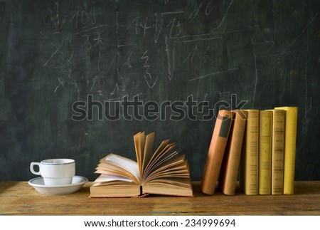books, cup of coffee, blackboard, education,learning,science concept