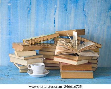 stacks of books and a cup of coffee, free copy space