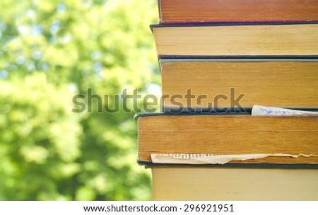 stack of books against nature background,free copy space
