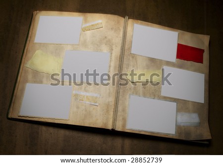 A dirty photo album with six deckle edged picture frames and copy space   - - grunge  - -
