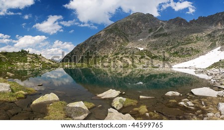 summer panorama of a small lake in Val di Sole, Trentino, italian alps