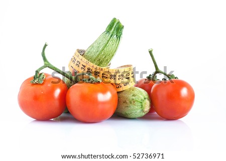 two courgettes and tomatoes with meter isolated on white background