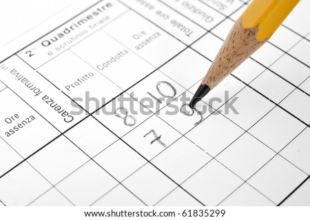 closeup of italian school report card with pencil