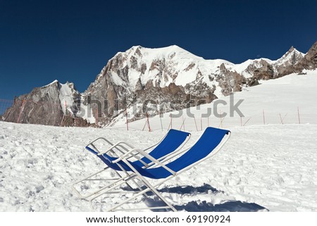 two chairs on the glacier with Mont Blanc mountain on background
