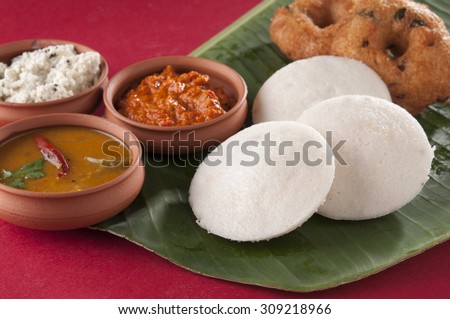 food South Indian food idli vada with sambar on a banana leaf