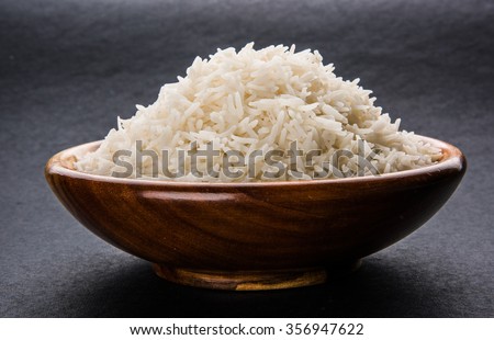 indian basmati rice, pakistani basmati rice, asian basmati rice, cooked basmati rice, cooked white rice, cooked plain rice in wooden bowl over black background