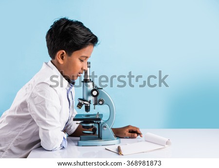 indian boy and microscope, asian boy with microscope, Cute little kid holding microscope, 10 year old indian boy and science experiment, boy doing science experiments