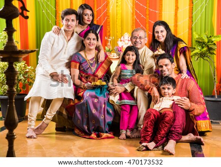 group photo of happy indian family in ganesh festival, happy indian family celebrating ganpati festival or ganesh utsav or ganesh festival