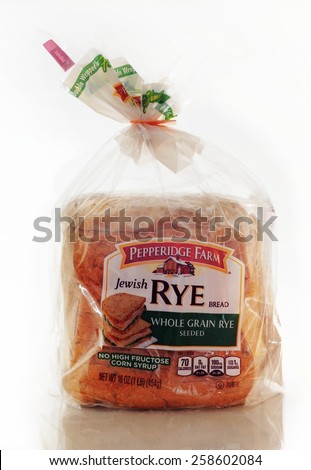 WEST PALM BEACH, FLORIDA - March 1, 2015: Pepperidge Farm Whole Grain seeded Rye Bread in a clear plastic bag with a green lable with a photo of a serving suggestion. Pepperidge Farm logo is red