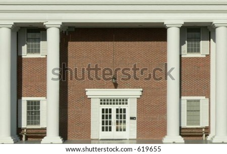 Plain brick exterior entryway to federal style office building