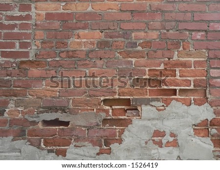Vintage brick wall with blank spaces where bricks have fallen out