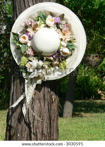 Silk flowers and lace adorn a large spring bonnet