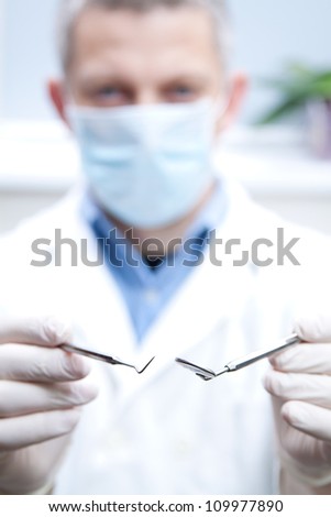 dental doctor with dental instruments