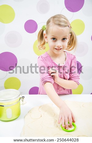 Smile blond girl make cake