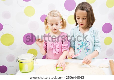 Sister making cake in kitchen