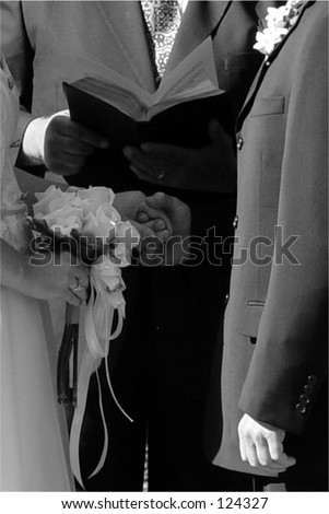 Classic wedding in black & white.  Note hesitance of groom, not holding bride\'s hands.