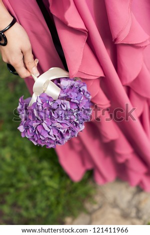 bouquet in the hands of the bridesmaid. Hydrangea flower.